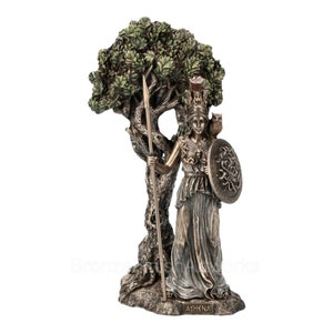 May include: A bronze-toned statue of Athena standing before a textured tree. The figure wears a helmet, holds a long spear, and carries a round shield with a Medusa emblem. An owl rests on the shoulder, and the base is labeled with the name ATHENA.