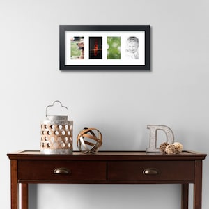 May include: A black rectangular collage picture frame with a white mat featuring four vertical openings. The frame displays a golden retriever, the Golden Gate Bridge, a green nature scene, and a smiling child in black and white.