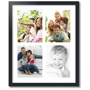 May include: A black picture frame with a white mat and four photos of a family. The photos show the family in different settings, including a park, a living room, and a close-up of a child.