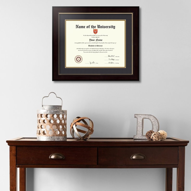 May include: A framed diploma with a black frame and gold matting. The diploma is for "Your Name" from "Name of the University".