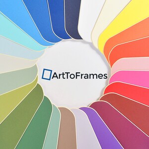 May include: A color wheel with a variety of colors, including blue, green, red, yellow, and orange. The colors are arranged in a circle, with the center of the circle being white. The text "ArtToFrames" is written in black letters on the white background.
