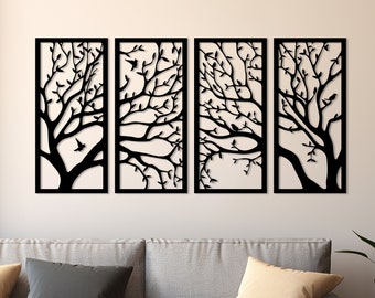 May include: A set of four black metal wall art panels featuring a silhouette of a tree with branches and birds. The panels are rectangular and have a modern design.