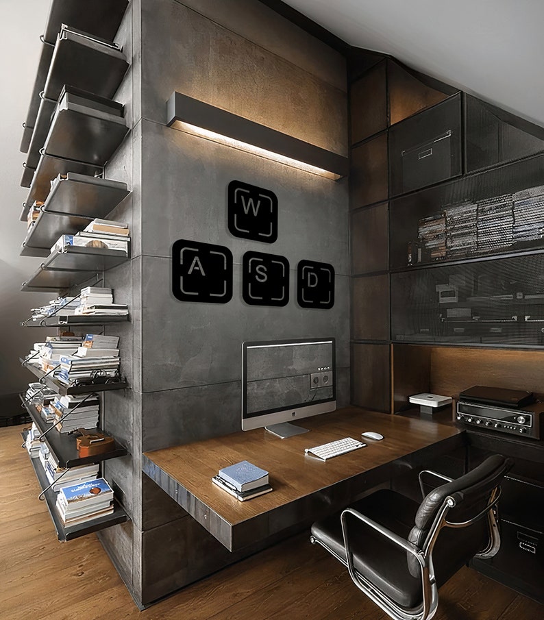 May include: A modern home office with a desk, a computer, and a chair. The wall behind the desk is decorated with black metal keyboard keys that spell out "WASD".