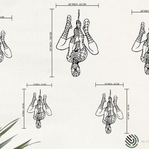 May include: Black and white line art of Spider-Man in various sizes, hanging upside down. The largest is 39 inches tall and 26 inches wide. The smallest is 8 inches tall and 5 inches wide. The image includes measurements in inches and centimeters.