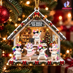 May include: A house-shaped Christmas ornament featuring five cartoon unicorns in an office setting. The sign reads BOSS' MAGICAL PAIN MAKERS. The unicorns are named Emma, Sophia, David, Lucas, and Olivia. The ornament is decorated with festive lights.