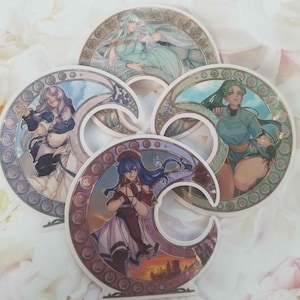 May include: Four decorative stickers featuring anime-style characters in a crescent moon design. Each sticker has a different character with a unique color scheme and intricate details. The stickers are perfect for adding a touch of whimsy to laptops, water bottles, or journals.