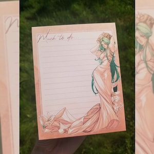 May include: A lined notepad with a peach-colored border and a watercolor illustration of a woman in a flowing gown. The notepad has the words "Much to do..." in cursive at the top.