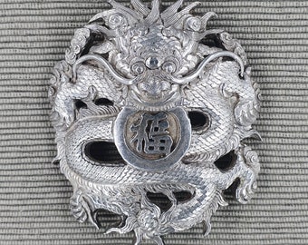 Vintage unique Chinese solid silver belt buckle shaped like a curled up dragon holding the character 'Fu' in its mouth.