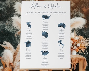 May include: A wedding seating chart with a watercolor map design. The chart is titled "Arthur & Ophelia" and lists guest names under different countries, including America, Peru, Australia, Tanzania, France, Iceland, and Italy.