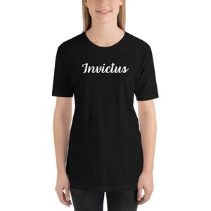May include: A black short-sleeved t-shirt with the word "Invictus" printed in white on the front.