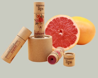 FASHIONISTA Grapefruit Lip Balm: Vegan, Zero-Waste, Paraben-Free. Nourish lips naturally with a touch of color. Sustainable and chic beauty!