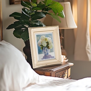 Watercolor print of delicate white hydrangea blossoms in a vintage-style grandmillennial vase, painted with a soft color palette.