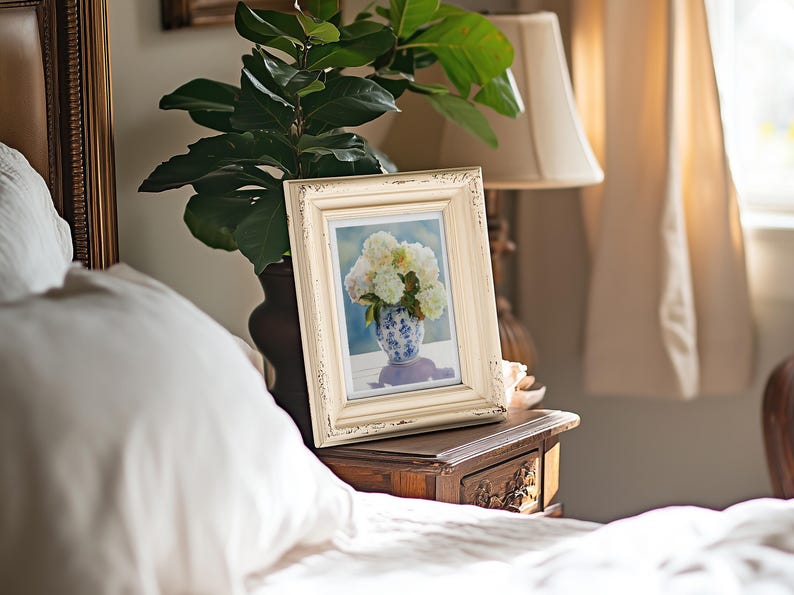Watercolor print of delicate white hydrangea blossoms in a vintage-style grandmillennial vase, painted with a soft color palette.