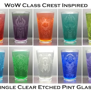 May include: Set of 10 etched pint glasses featuring World of Warcraft class crests. Each glass is clear and features a different class crest in a white etched design. The glasses are filled with different colored liquids, showcasing the etched designs.