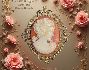 Elegante broche vintage de camafeo con detalle tallado en blanco.