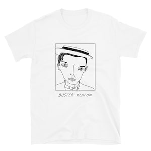 Puede incluir: Un dibujo en blanco y negro de Buster Keaton con un sombrero. El dibujo está en una camiseta blanca. El texto "Buster Keaton" está debajo del dibujo.
