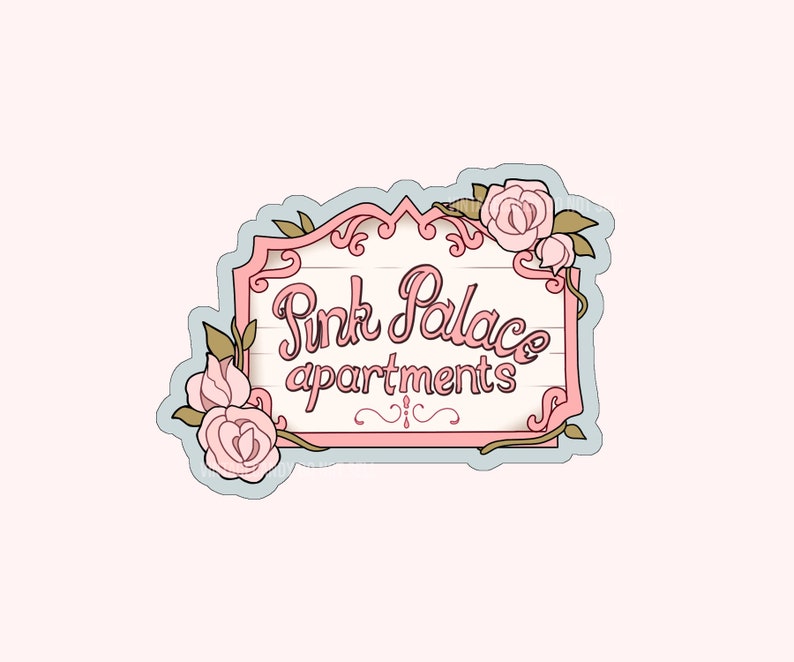 May include: A pink and white sign with the text "Pink Palace Apartments" in cursive script. The sign is decorated with pink roses and vines.