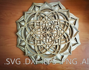 May include: A detailed wooden mandala design with intricate cutouts, creating a layered effect. The mandala is a circular pattern with a symmetrical design, featuring a central motif surrounded by repeating patterns.