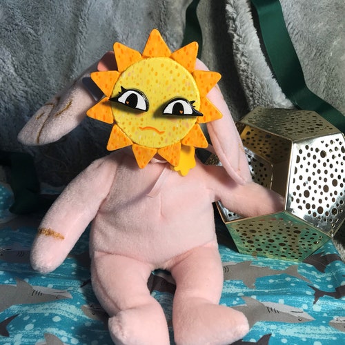 stuffed animals with clay faces