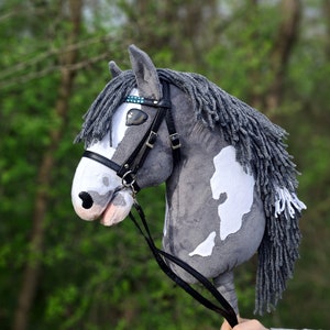 GREY and WHITE spotted hobby horse with tack/bridle