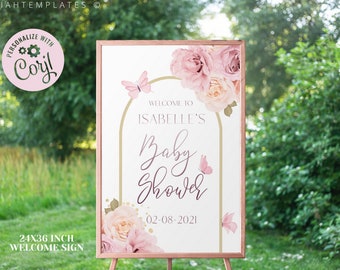 May include: A 24x36 inch welcome sign for a baby shower with a pink and gold floral design. The sign says "Welcome to Isabelle's Baby Shower 02-08-2021".