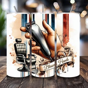 May include: A white tumbler with a design of a hand holding a barber's clippers, a barber chair, and the words "Blessed Hands".