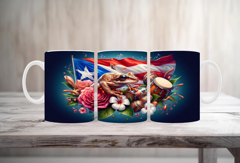 May include: White ceramic mug featuring a vibrant design with the Puerto Rican flag, a frog, flowers, and musical instruments. The design is set against a dark blue background. The mug is displayed on a wooden surface.
