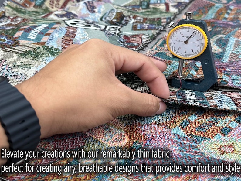 May include: Close-up of a hand holding a fabric measuring tool, showing the thinness of the fabric. The fabric is colorful and patterned. The text "Elevate your creations with our remarkably thin fabric perfect for creating airy, breathable designs that provides comfort and style" is visible at the bottom of the image.
