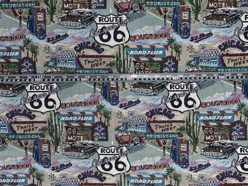 May include: A colorful fabric with a repeating pattern of Route 66 signs, cars, and roadside attractions. The fabric features the words "Route 66", "Hollywood", "Chicago", "Tourist Inn", "Motel", and "Trails West".