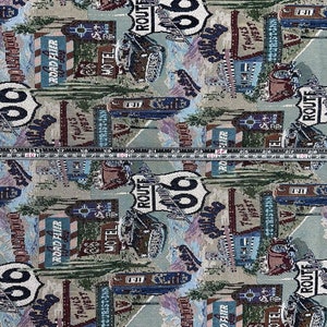 May include: A colorful fabric with a repeating pattern of Route 66 signs, motel signs, and vintage cars. The fabric is a light beige color with blue, red, and green accents.