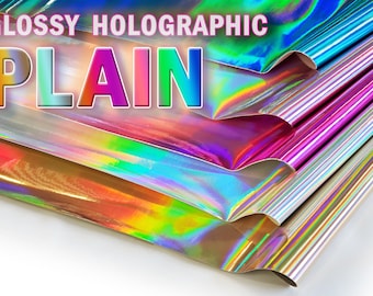 May include: A stack of glossy holographic vinyl sheets in various colours, including blue, pink, gold, and silver. The text "GLOSSY HOLOGRAPHIC PLAIN" is printed on the top sheet.