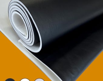May include: A rolled-up sheet of black faux leather with a white backing. The material is shown partially unrolled, revealing the layers. Three color swatches of black, white, and off-white are at the bottom.