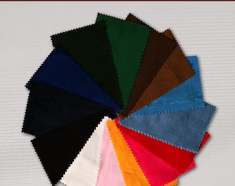 May include: A variety of corduroy fabric swatches in different colors, including black, navy, green, brown, blue, red, orange, pink, and white. The fabric is arranged in a circle, with the text "CORDUROY WALE 21" at the top.