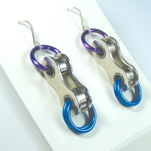Sturdy bike chain earrings adorned bright colored aluminum rings. Handmade.