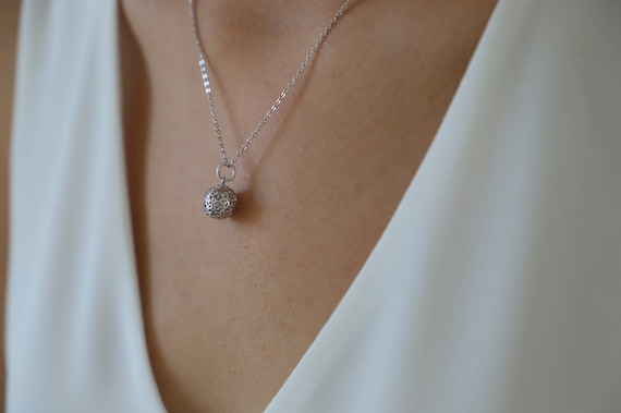 Angel on sale ball necklace