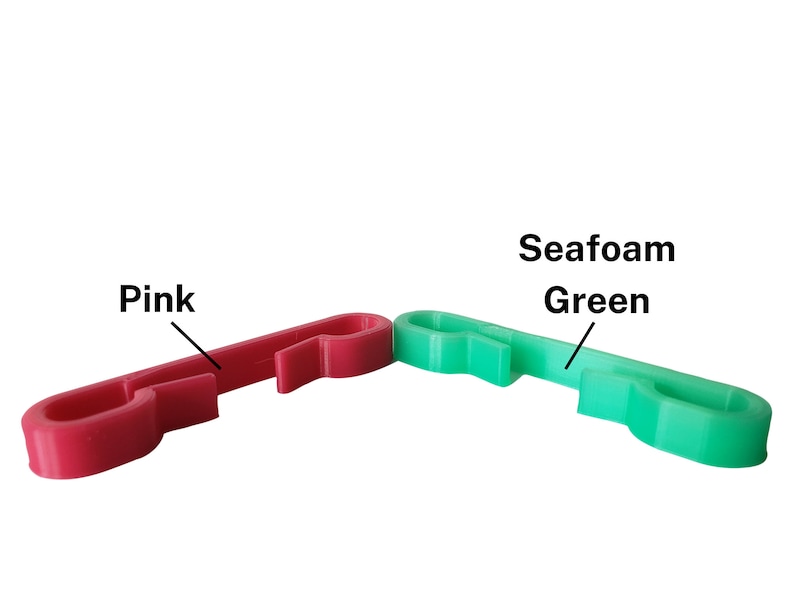 Pink and seafoam green sternum clips for string backpack