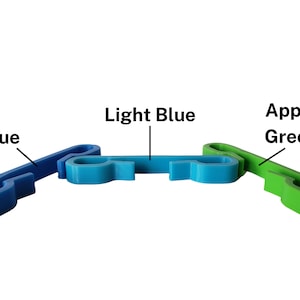 Blue, light blue, and apple green sternum clips for drawstring bag