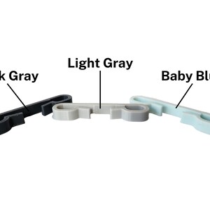 Dark gray, light gray, and baby blue string backpack clips