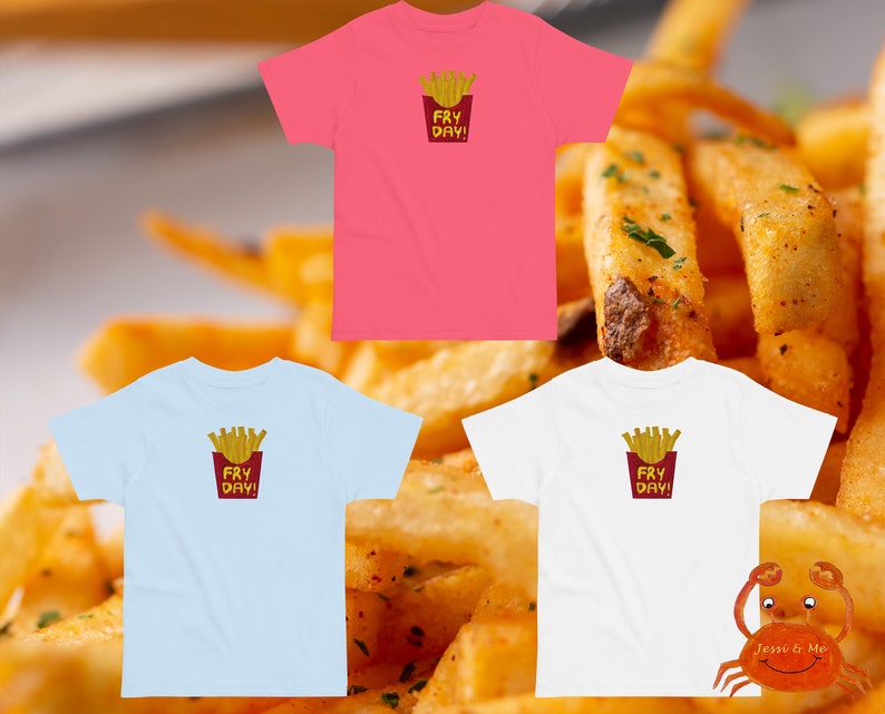 May include: Three t-shirts featuring a graphic of french fries in a red container with the text "Fry Day!" on each shirt. The shirts are pink, light blue, and white.
