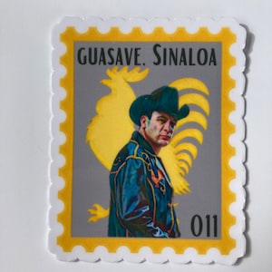 May include: A yellow and white sticker with a gray background. The sticker features a man wearing a cowboy hat and a leather jacket. The man is standing in front of a yellow rooster. The sticker says "GUASAVE. SINALOA" and "011".