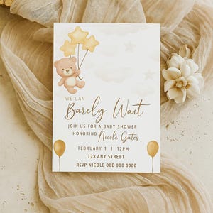 May include: A baby shower invitation with a cute cartoon bear holding balloons. The invitation says "We can Barely Wait" and includes the name "Nicole Gates", the date "February 1", the time "12PM", the address "T23 Any Street", and the RSVP information "RSVP Nicole 00D 000 0000".