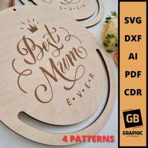 May include: A wooden sign with the text "Best Mum Ever" in a decorative script font. The sign is round and has a cutout handle. The sign is on a white background.