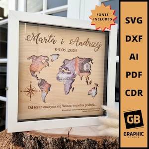 May include: A framed wooden world map with currency accents, featuring the names "Marta i Andrzej" and the date "04.05.2025". The frame is white, and the map includes a compass rose. Text on the image reads "FONTS INCLUDED".
