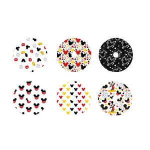 May include: Six circular designs with Mickey Mouse patterns. The designs feature Mickey's face, hearts, and gloves in red, yellow, black, and white. The patterns are set against a white background, offering a playful aesthetic.