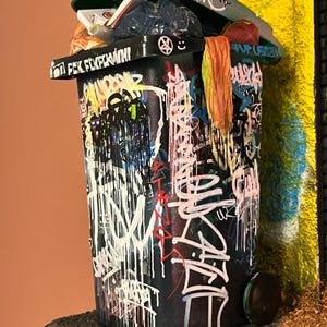 Graffiti trash can