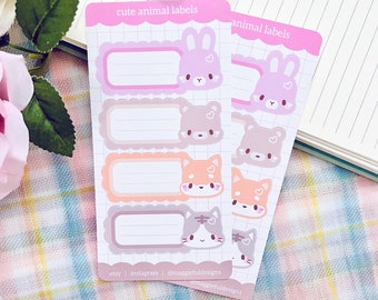 May include: A set of four pink and purple animal-themed labels with a bunny, bear, fox, and cat. Each label has a white space for writing. The labels are on a white background with a grid pattern. The text "cute animal labels" is at the top of the sheet.