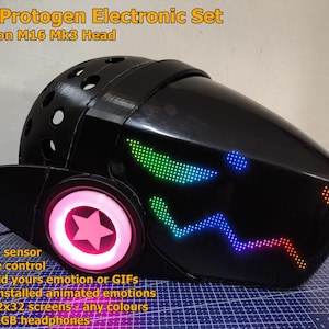 May include: A black RGB Protogen electronic set based on M16 Mk3 Head. The helmet has a glowing pink star and circle on the side, with colourful LED displays forming eyes and a mouth. The image text highlights features such as a "boop" sensor and remote control.