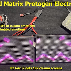 May include: RGB LED Matrix Protogen Electronic Kit with two rectangular screens displaying a purple animated face. Includes a remote control and features interactive and boop sensor capabilities. The screens measure 192x96mm.
