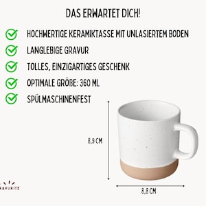 May include: A white ceramic mug with a speckled design and a tan base. The mug is 8.8 cm wide and 8.9 cm tall, with a capacity of 360 ml. Text in German indicates it is dishwasher safe.
