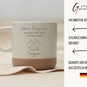 Puede incluir: Una taza de cer&aacute;mica blanca moteada con base y asa de color beige. La taza presenta una ilustraci&oacute;n de ping&uuml;ino y texto en alem&aacute;n. El texto incluye las palabras "Wenn Pinguine" y "Du bist mein Pinguin".